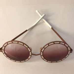 Pared Sonny and Cher sunglasses